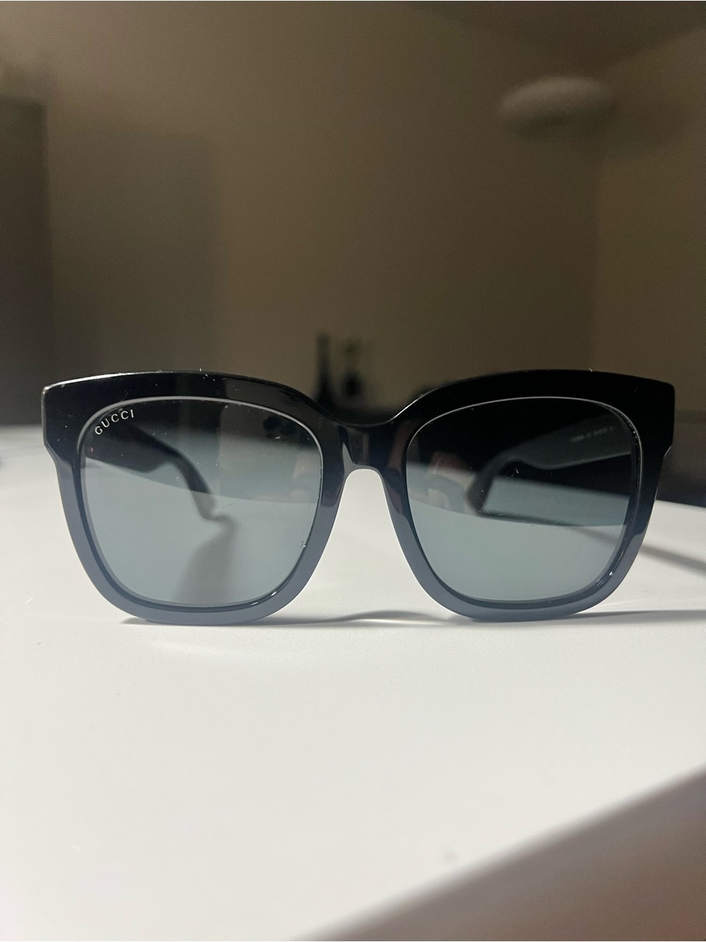 Gucci Black Frame Sunglasses with Gray Lenses